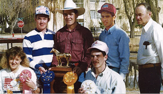 NMSU horse judging team after a contest in Fort Worth in 1989. Back row: Jeff Mobley, Herb Borden, Johnny Perea,  L. Neil Burcham (coach). Front Row: Tracey Bays, Kenneth Lujan.